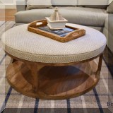 F16. Round wood and fabric coffee table. 
